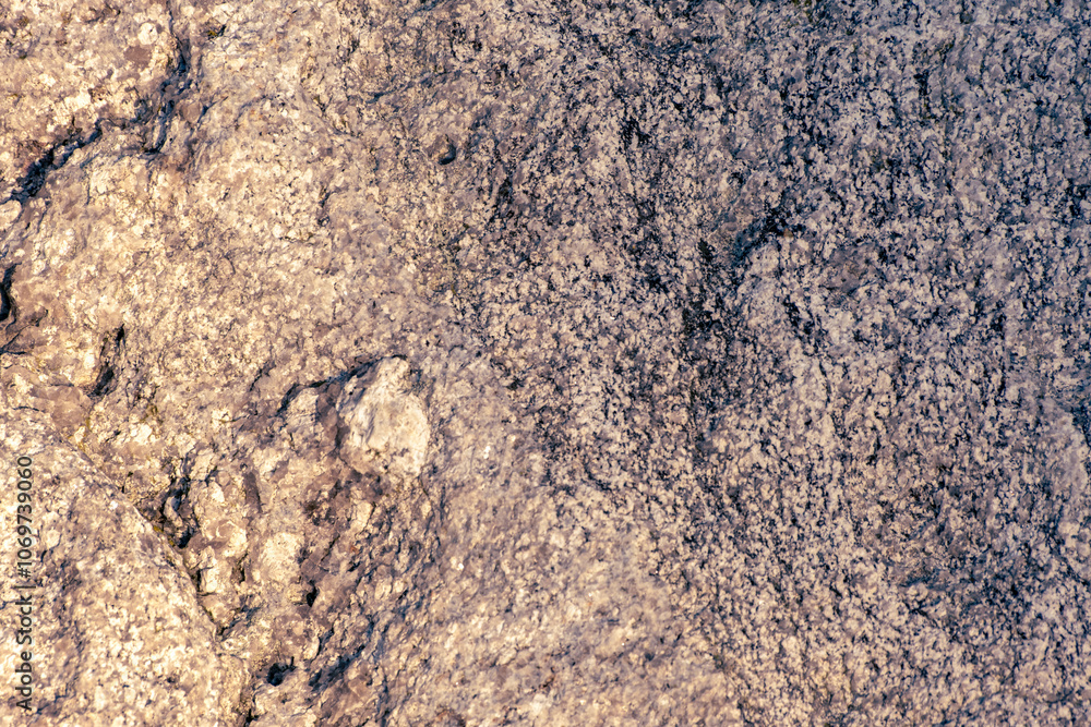 granite rock surface as natural background. Rough raw stone texture. Unique exclusive nature material. granite rock surface as natural background. Rough raw stone texture. Unique exclusive nature material.