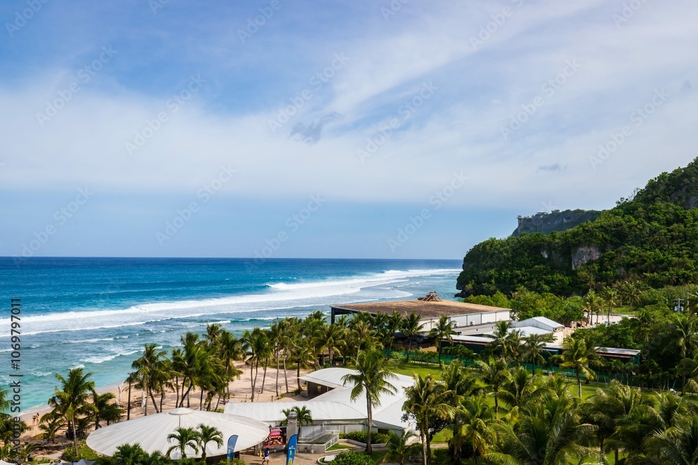 Scenic Coastal View with Lush Greenery and Ocean Waves Crashing onto the Shore, Guam Scenic Coastal View with Lush Greenery and Ocean Waves Crashing onto the Shore, Guam