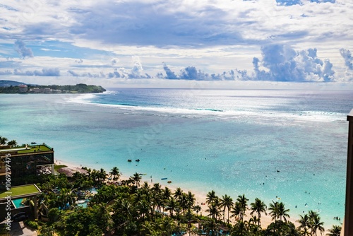 Breathtaking View of Tumon Bay with Clear Blue Waters and Palm Trees in Guam photo