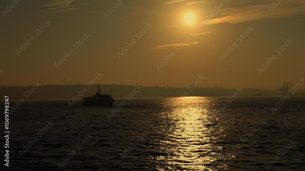 Istanbul at sunset and ferries sailing over the sea Istanbul at sunset and ferries sailing over the sea