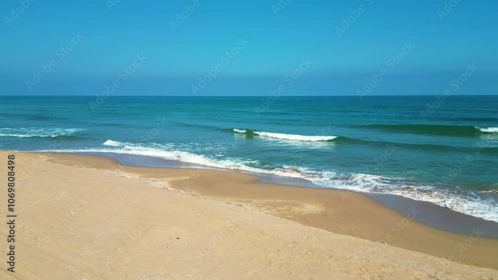 Waves of Mediterranean Sea rolling in sunshine to the sandy beach. Beautiful Turkish nature. Close-up shot of calming foamy water. Waves of Mediterranean Sea rolling in sunshine to the sandy beach. Beautiful Turkish nature. Close-up shot of calming foamy water.