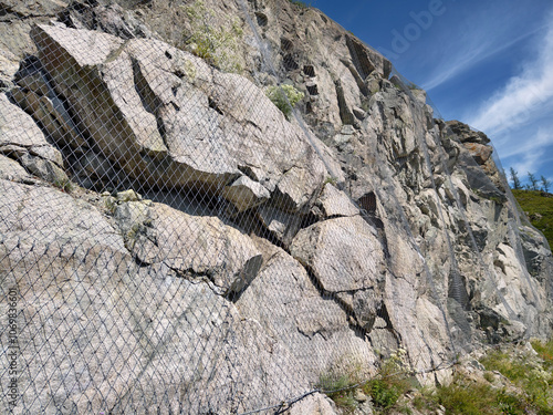 Obraz na plátně Metal protecting net on mountain stone slope in Altai