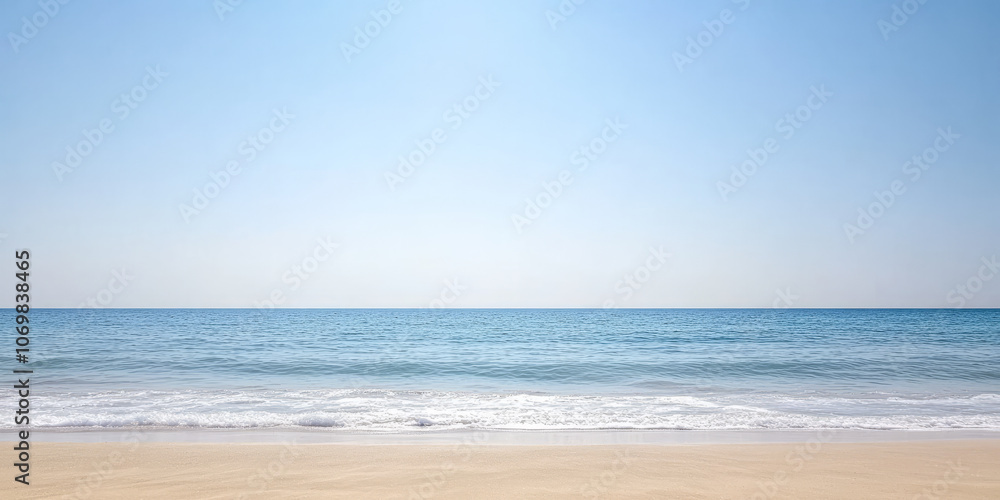 Serene coastal view of calm ocean waves gently lapping on sandy beach under clear blue sky Serene coastal view of calm ocean waves gently lapping on sandy beach under clear blue sky