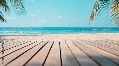 Tropical beach view with wooden deck, clear blue water, and palm trees.