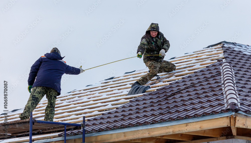 custom made wallpaper toronto digitalTwo men are working on a roof, one of them holding a tape measure