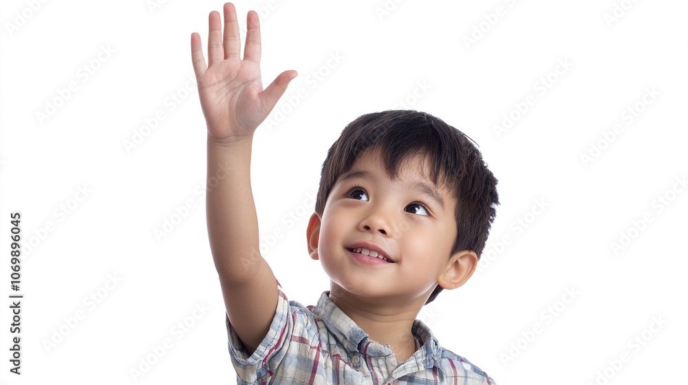 Young Boy Raising Hand in Classroom Setting Young Boy Raising Hand in Classroom Setting