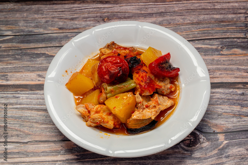Traditional delicious Turkish dishes; potato, tomato, pepper, garlic and meat dish (Turkish name; Fırında tas kebabı,)