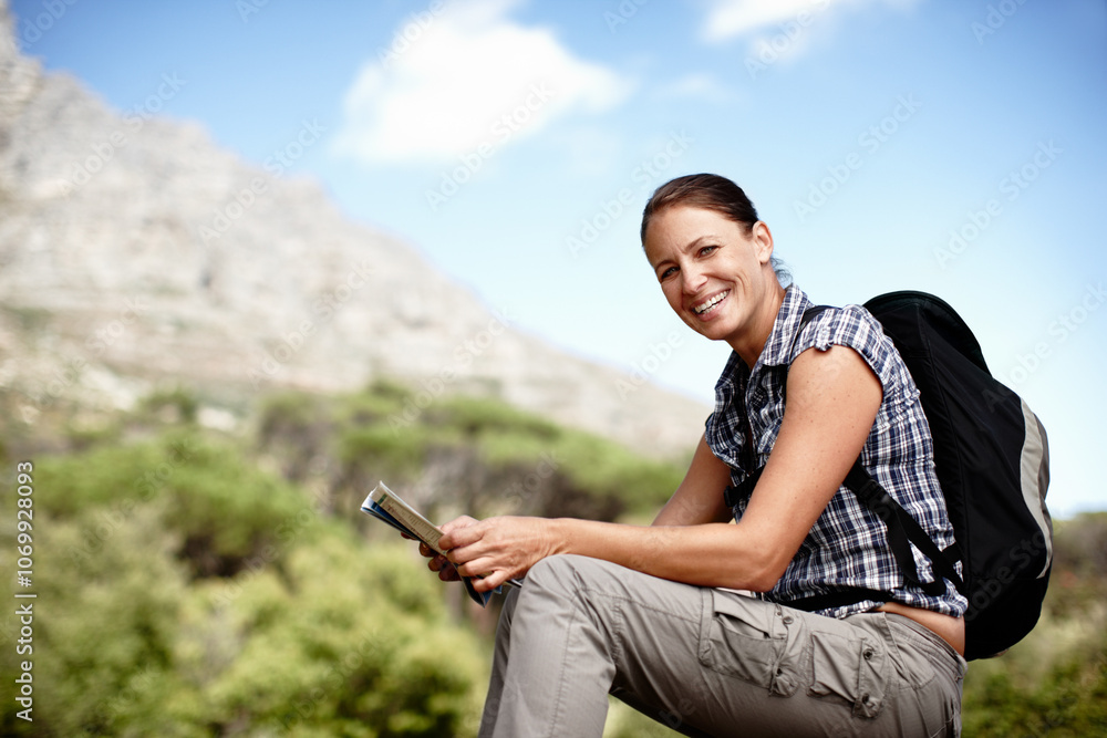 Naklejka premium Hiking, woman and map in nature with portrait, direction and journey navigation at space. Happy person, backpack or geography diagram on mountain for trekking, travel planning or guidance in Portugal