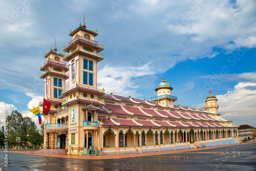 Cao Dai temple area and meditating followers of the Cao Dai religion in the temple Cao Dai, Tay Ninh, Vietnam photo