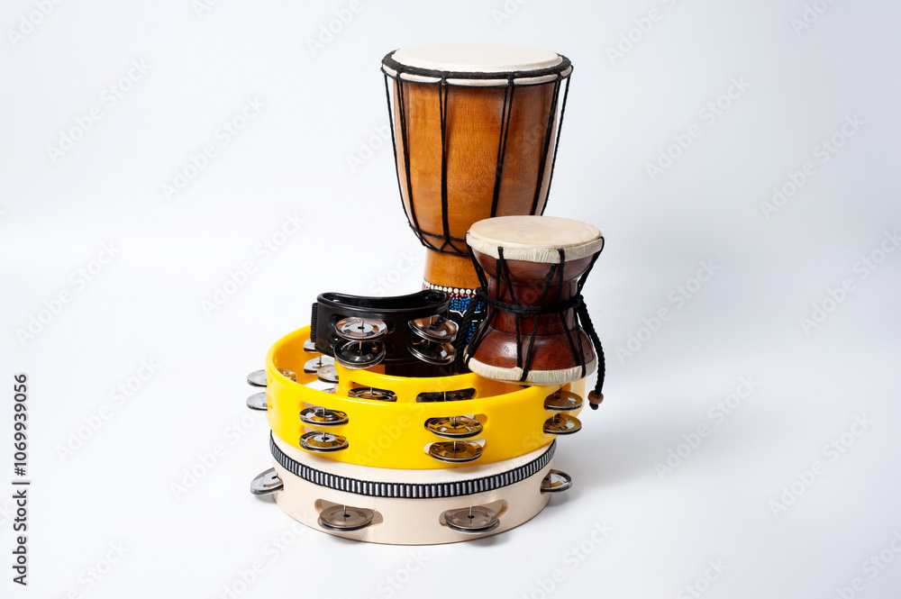 Tambourine and other percussion musical instruments, shot on a white background. Tambourine and other percussion musical instruments, shot on a white background.