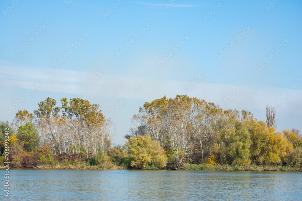 Scenic autumn riverside with clear blue sky. Scenic autumn riverside with clear blue sky.