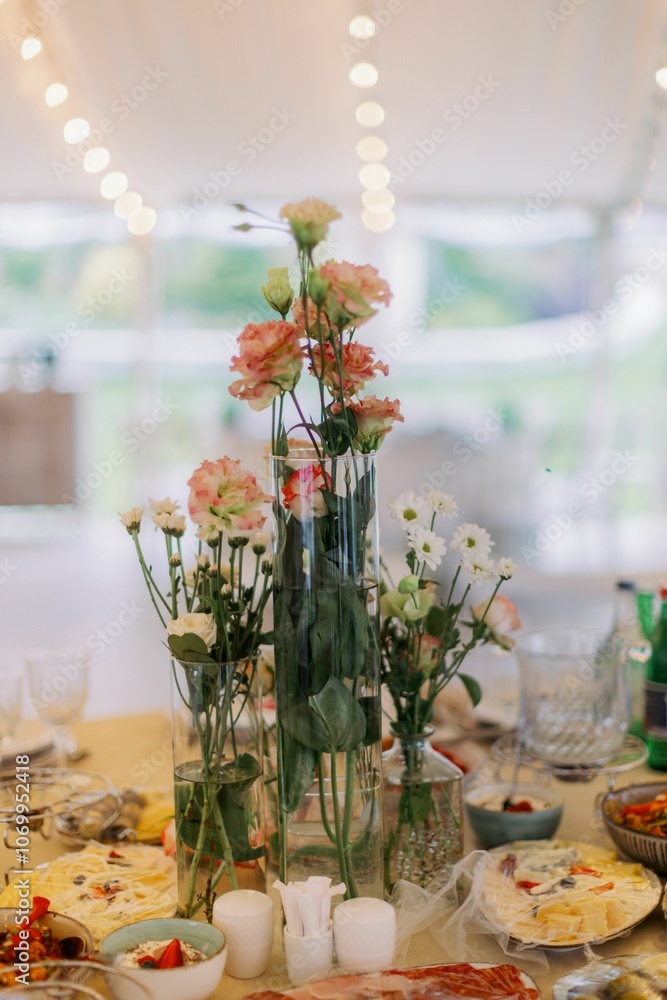 Elegant floral centerpiece on a dining table. Elegant floral centerpiece on a dining table.