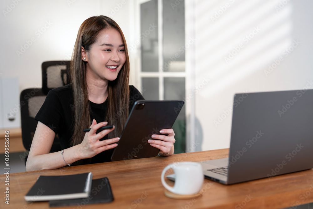Cheerful business lady working on laptop in home office, Cheerful business lady working on laptop in home office,