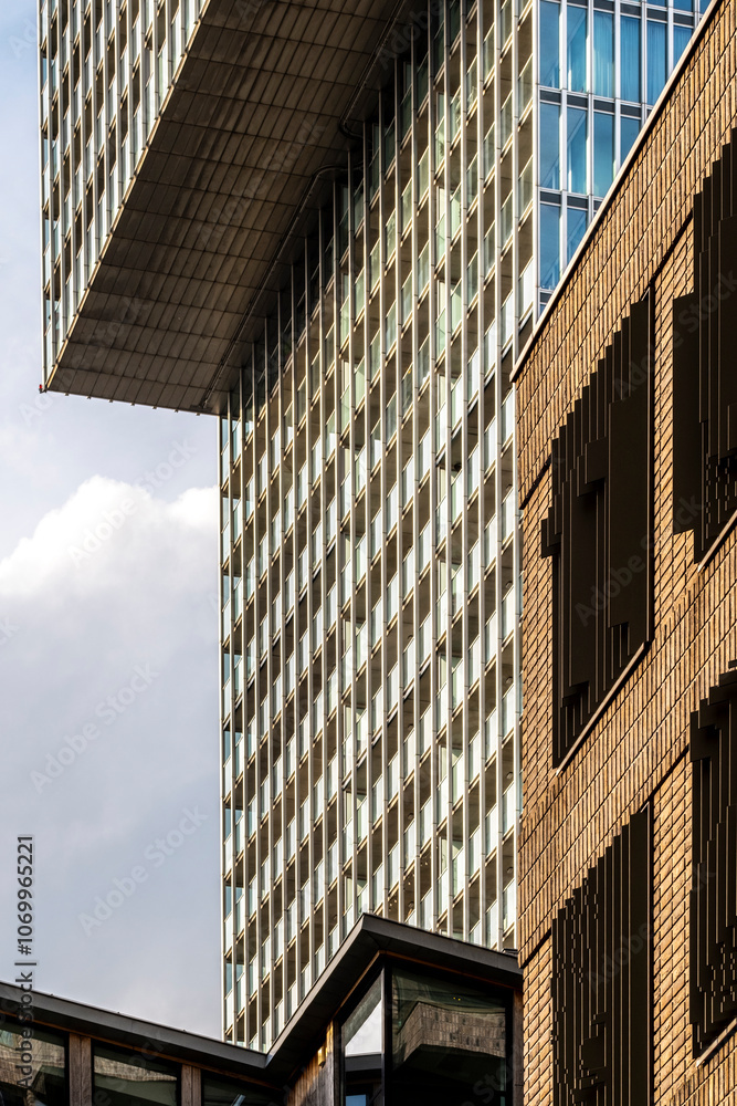 Geometric patterning and dramatic angles depict silhouetted modern structures intersecting under a vibrant blue sky, creating an image of urban architectural innovation. Geometric patterning and dramatic angles depict silhouetted modern structures intersecting under a vibrant blue sky, creating an image of urban architectural innovation.