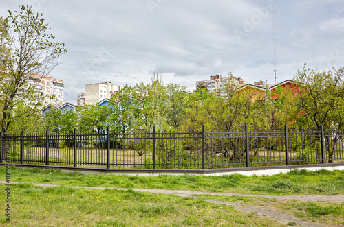 Wallpaper Mural Metal fence in the city park. Decorative black iron guardrail for protection Torontodigital.ca