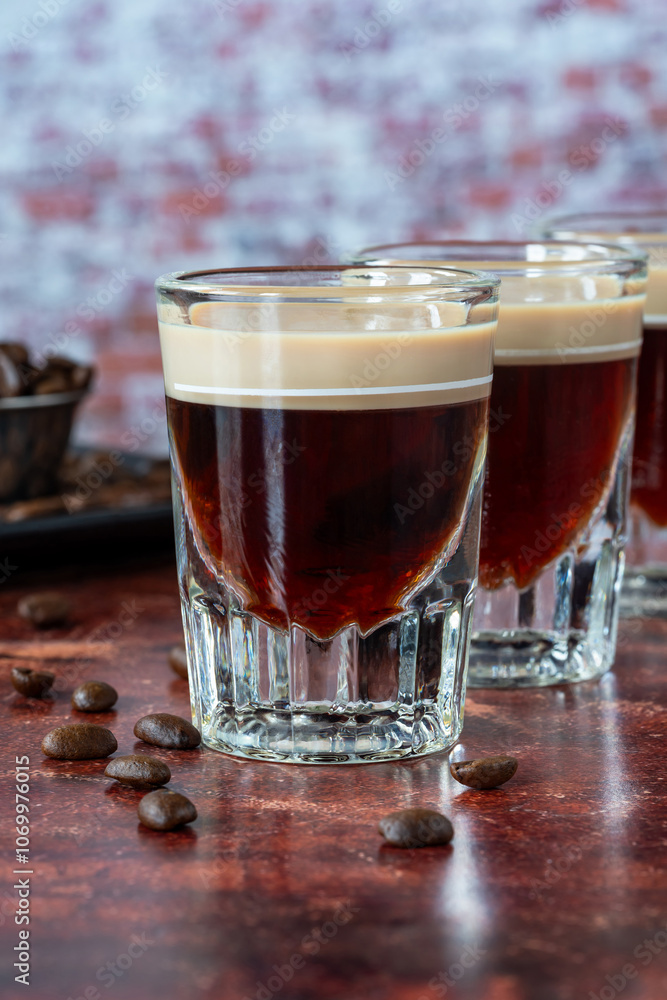 St. Patrick’s Day cocktail of layered Irish cream and coffee liqueur made to look like mini stout shot St. Patrick’s Day cocktail of layered Irish cream and coffee liqueur made to look like mini stout shot