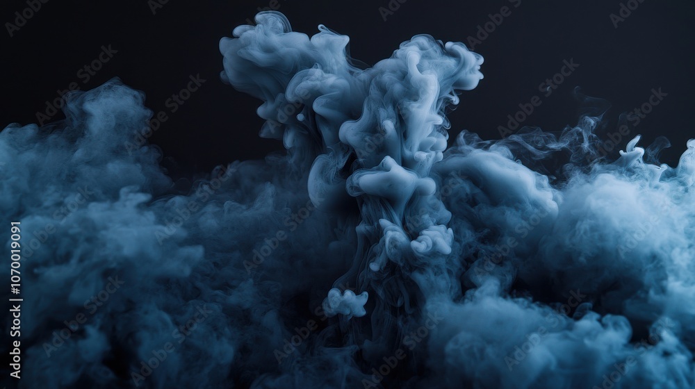 Naklejka premium A mesmerizing blue smoke formation gently swirls against a dark background, creating a mystical atmosphere.