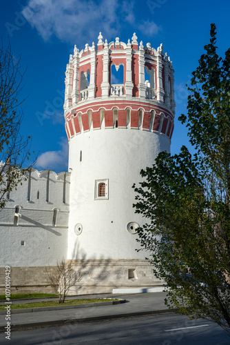 Nikolskaya Tower of the Theotokos-Smolensky Novodevichy Monastery of the XVI century in Moscow on an autumn sunny day