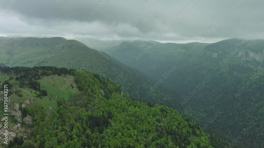 Aerial view of dark clouds over summer green mountains landscape, 4k Aerial view of dark clouds over summer green mountains landscape, 4k