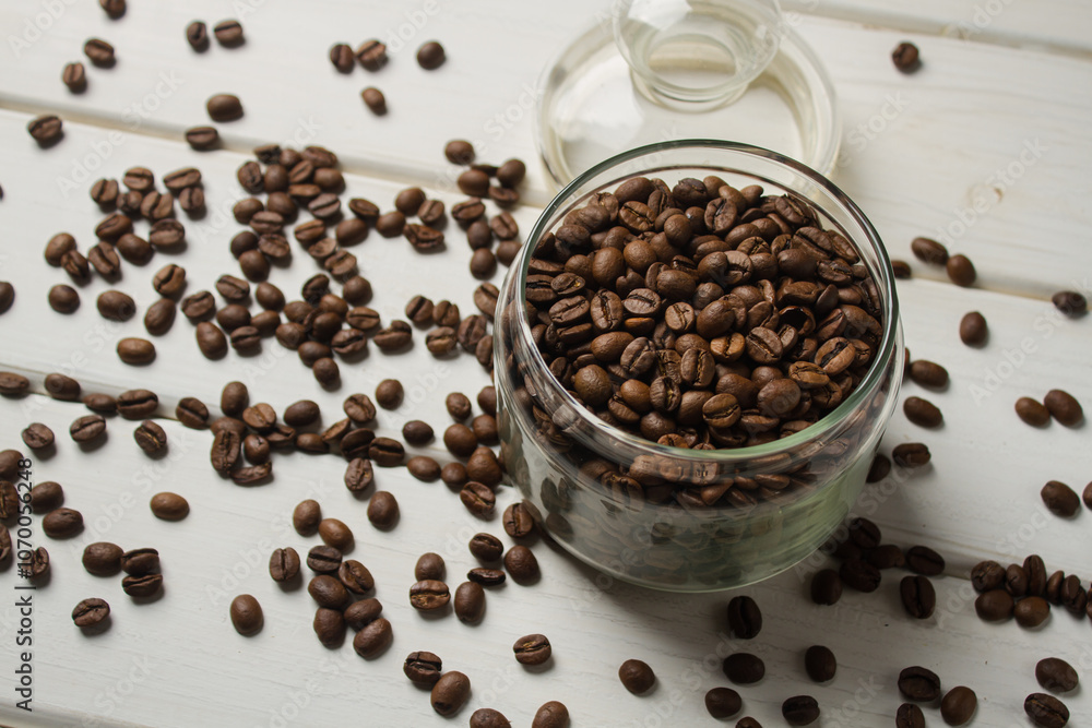 Jar with coffee beans on white table Jar with coffee beans on white table