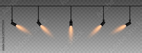 Row of adjustable spotlights emitting a soft gold glow. Angled lights create a focused beam effect, adding ambiance to a dark background. Modern interior designs, exhibitions, and stage lighting