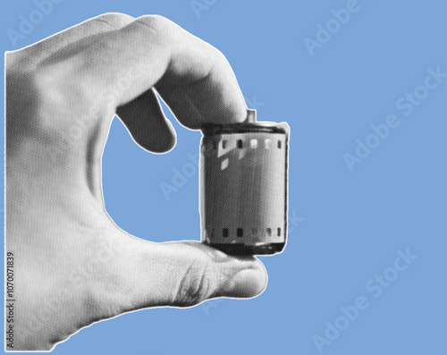 close up of hand holding 35mm roll film camera pixelate grayscale color halftone dotted texture style collage element isolated on blue background