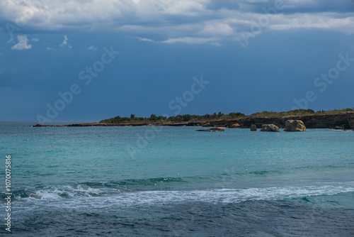 Landscape of a beautiful beach with clear and crystalline turquoise water and fine sand in Sicily in Syracuse called Fontane Bianche. June 2023 photo