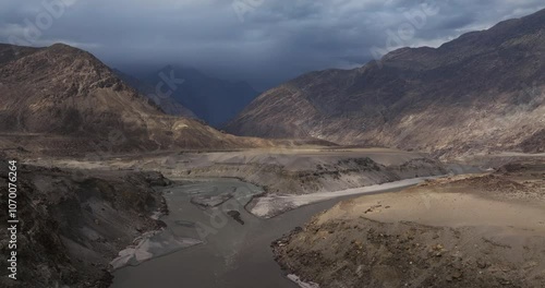 Aerial ascend above the Three Mountains Junction View Point in Pakistan, where the Himalayas, Karakorams, and Hindukush meet photo