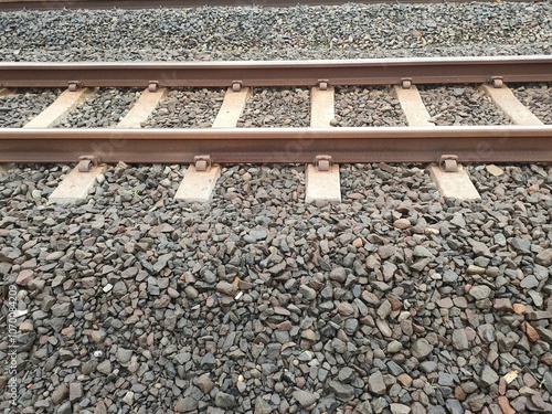 Foto Close up of railroad tracks on gravel on a sunny morning