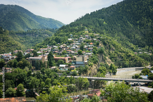 Wallpaper Mural Summer view of Borjomi, Georgia, captured from Cross Mountain. The town lies nestled among green trees, with a river winding through it and surrounded by scenic mountains Torontodigital.ca