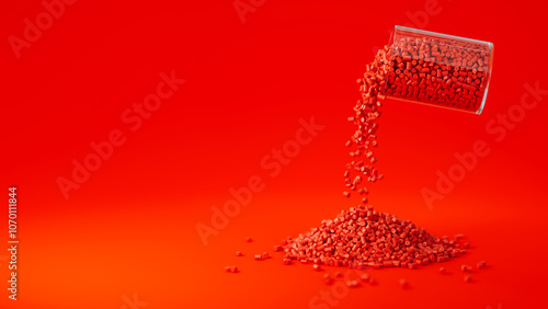 Red plastic polypropylene granules pouring from the glass on a red backdrop, masterbatch polymer grain pile. HDPE or PVC resin pellets. Place for text. 3d render illustration photo