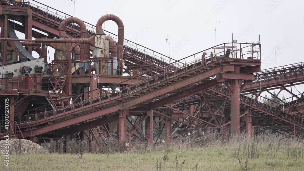 Open-air sand and crushed stone mining and sorting plant. How sand is extracted, cleaned and sorted in the quarry. Open-air sand and crushed stone mining and sorting plant. How sand is extracted, cleaned and sorted in the quarry.