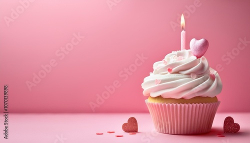 pink cupcake with candle