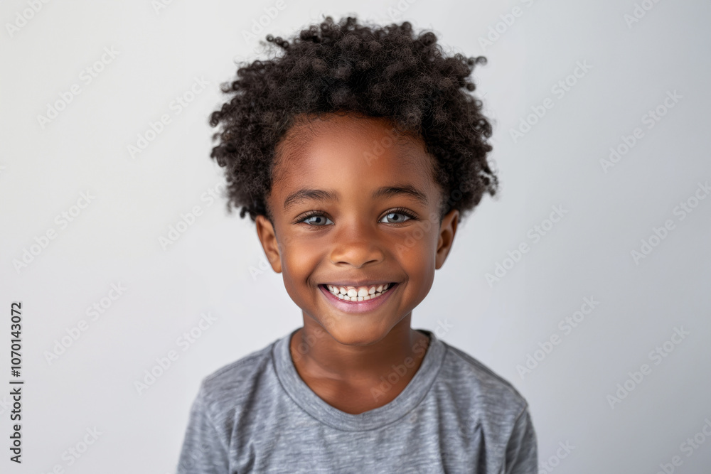 young african boy with bright smile, standing confidently in front of a simple white background. He is dressed in his casual, everyday attire, conveying sense of happiness and warmth. young african boy with bright smile, standing confidently in front of a simple white background. He is dressed in his casual, everyday attire, conveying sense of happiness and warmth.