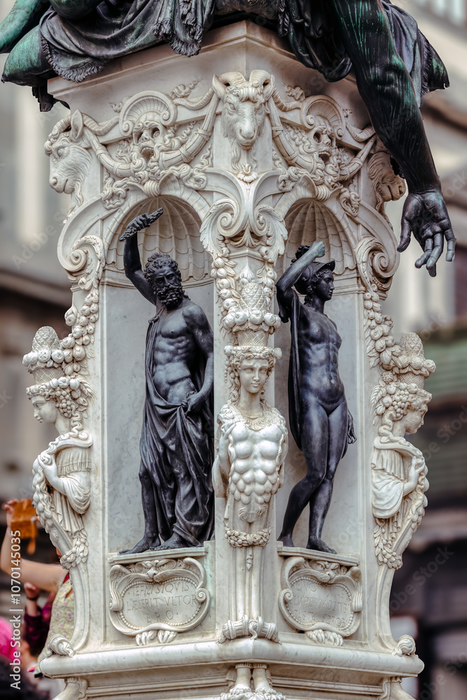 Base of the statue of Benvenuto Cellini's Perseus. Tuscany, Florence, Italy. Perseus with the Head of Medusa is a bronze sculpture made by Benvenuto Cellini in the period 1545–1554