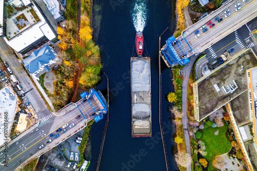 Фотография Drone Shot of Tugboat and Barge Passing Under Fremont Bridge on Lake Union, Seat