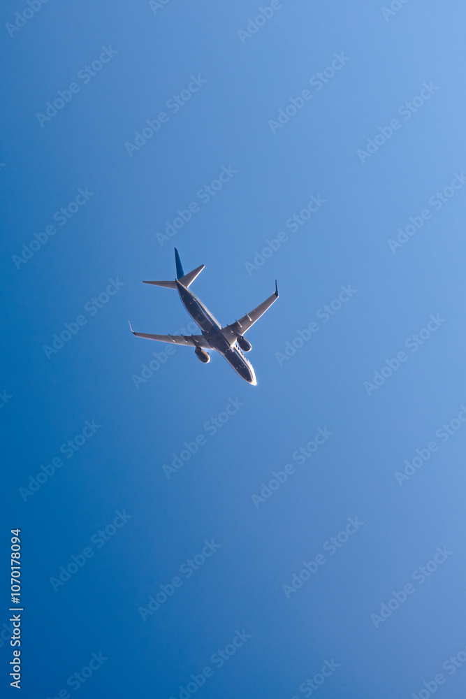 flying plane against the blue sky flying plane against the blue sky
