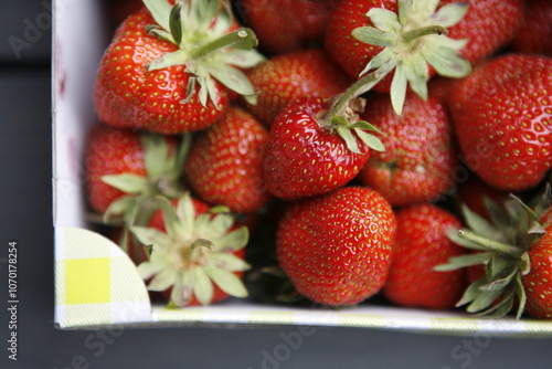 Juicy red strawberries in a container
