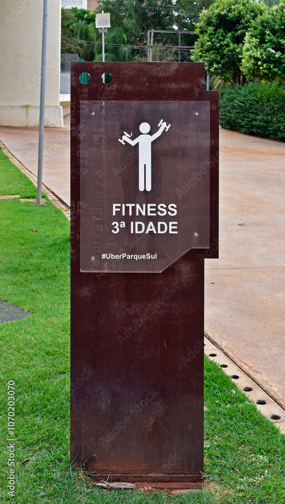 Metal display totem on public park indicating exercise area for seniors in Ribeirao Preto, Sao Paulo, Brazil