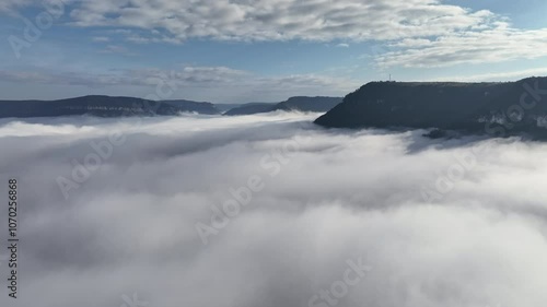 Clouds covering a valley aerial Millau sunny day 