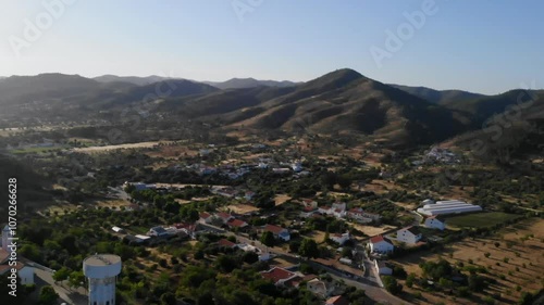 Drone shot of the hills, vallies and fields by Salir in Algarve, Portugal. photo