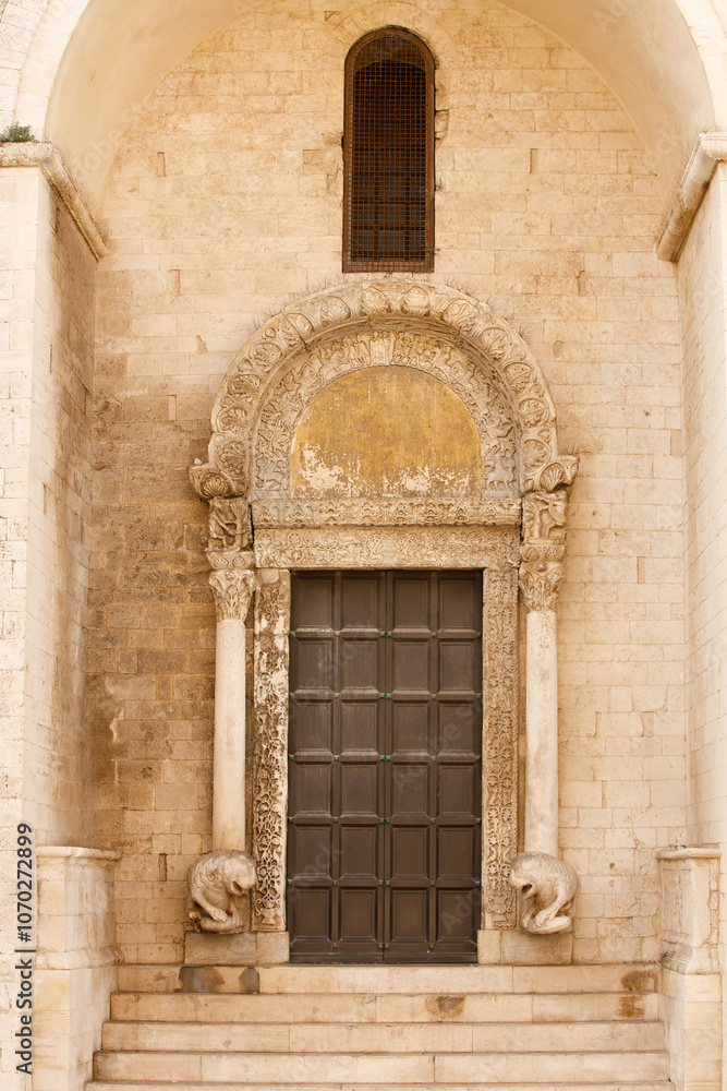 Fototapeta premium Entrance door of The Basilica of Saint Nicholas ( San Nicola ) in Bari, Roman Catholic Church in region of Apulia