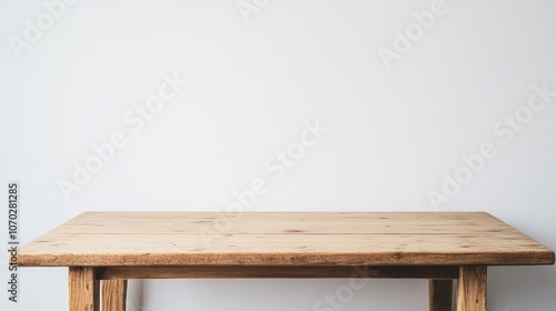 Fototapeta Naklejka Na Ścianę i Meble -  Stylish wooden table set against a plain white backdrop