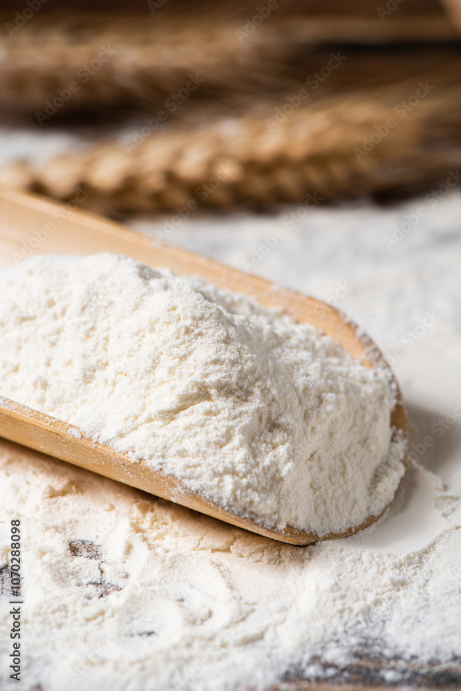 wheat flour and wheat ears on wooden table wheat flour and wheat ears on wooden table