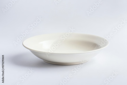 A white bowl with a white rim sits on a white background. The bowl is empty and has a clean, minimalist appearance. Empty space for logo or text, mockup