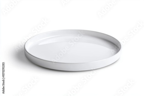 A white plate with a round shape. It is empty. The plate is placed on a white background. Empty space for logo or text, mockup