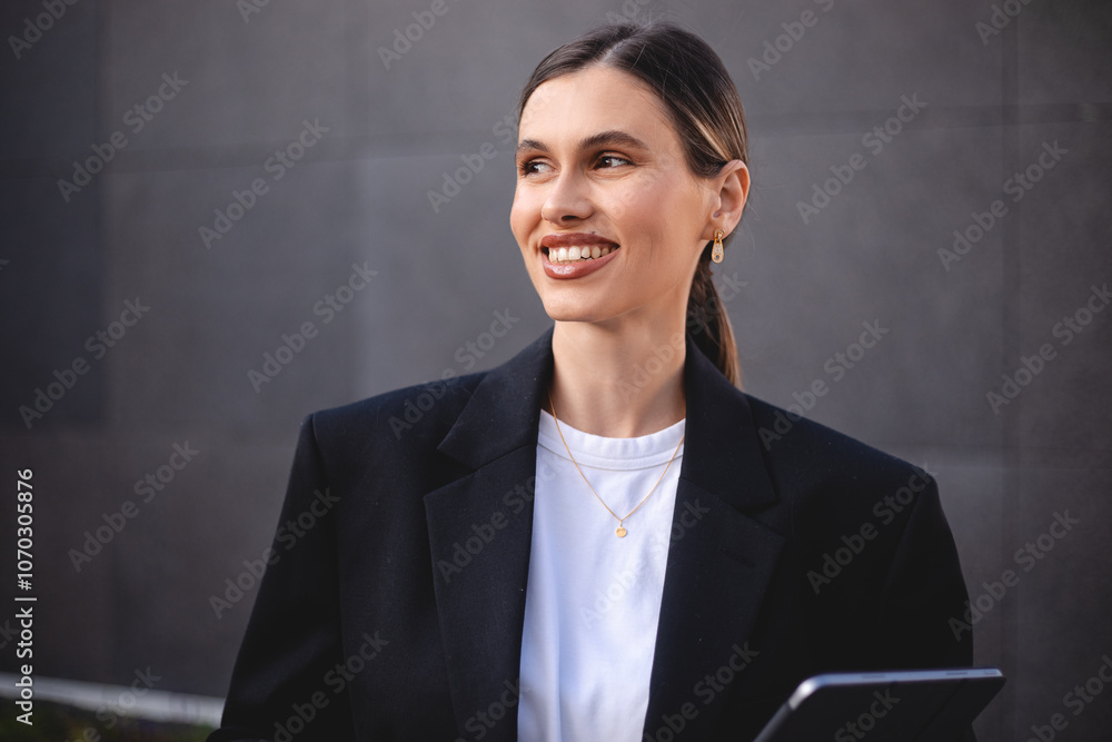 Smiling business female employee hold tablet look thoughtful, dreaming, happy millennial woman worker hold pad gadget, lost in thoughts visualizing, business vision. Laughing woman with ponytail Smiling business female employee hold tablet look thoughtful, dreaming, happy millennial woman worker hold pad gadget, lost in thoughts visualizing, business vision. Laughing woman with ponytail
