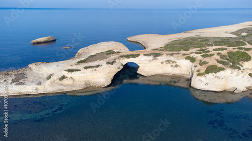 aerial view of the rock of S'Archittu di Santa Caterina in the province of Oristano, Sardinia, Italy photo