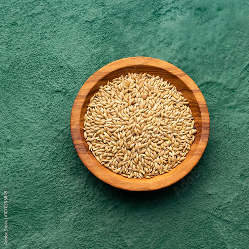 Phalaris canariensis - Canary seed in the bowl. photo