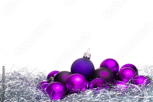 Fotografie Purple christmas balls on a white background with copy space.